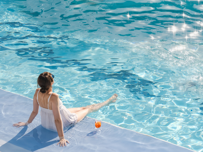 woman on the side of the pool