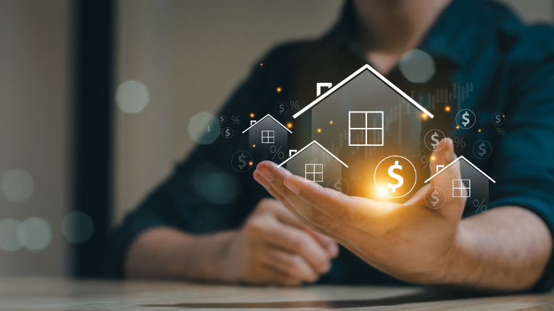 man holding hologram house and coins